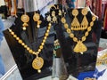 beautiful Indian, Oriental vintage women's gold earrings on shop window.