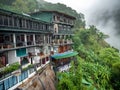 Beautiful indian traditional house on mountain slope in tropical jungle forest