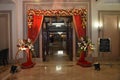 Beautiful Indian wedding ceremony stage set in colors and entrance in red and floral designs