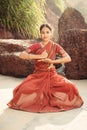 Beautiful indian woman dancer in traditional clothes at sunset Royalty Free Stock Photo