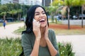 Beautiful indian woman laughing at phone Royalty Free Stock Photo