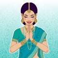 Beautiful indian woman saying namaste