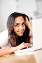 Beautiful Indian woman student using laptop computer at home Royalty Free Stock Photo