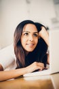 Beautiful Indian woman student using laptop computer at home Royalty Free Stock Photo