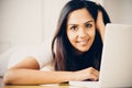 Beautiful Indian woman student using laptop computer at home Royalty Free Stock Photo