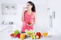 Beautiful Indian Woman tasting strawberry Royalty Free Stock Photo