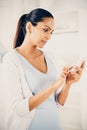 Beautiful Indian woman using mobile phone happy Royalty Free Stock Photo