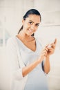 Beautiful Indian woman using mobile phone happy Royalty Free Stock Photo