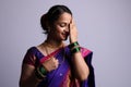 Beautiful Indian women wearing saree showing hand gestures while smiling. Royalty Free Stock Photo