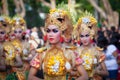 Beautiful indonesian dancers in colorful sarongs with religious offers