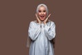 Beautiful indonesian hijab women with shocked expressions while smiling