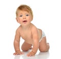 Beautiful Infant child baby girl in diaper learning how to Royalty Free Stock Photo