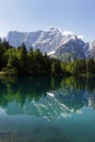 Beautiful Inferiore Fusine lake with Mangart mountain reflection, Julian Alps, Italy, Europe. Royalty Free Stock Photo