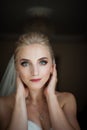 Beautiful innocent blonde bride with blue eyes posing, face closeup Royalty Free Stock Photo