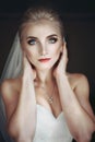 Beautiful innocent blonde bride with blue eyes posing, face closeup Royalty Free Stock Photo