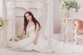 Beautiful innocent brunette bride in white dress posing Royalty Free Stock Photo