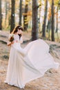 Beautiful innocent young brunette bride in gorgeous white dress at forest Royalty Free Stock Photo