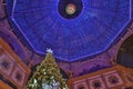 Beautiful inside panoramic view to the Vittorio Emanuele II Gallery Christmas Tree and blue crest made of Swarovski crystals. Royalty Free Stock Photo