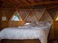 Beautiful inside view of wood glamping bed Royalty Free Stock Photo