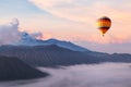 Beautiful inspirational landscape with hot air balloon flying in the sky, travel