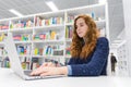 Beautiful Intelligent University Girl Using Laptop in White Mode