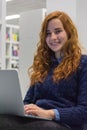 Beautiful Intelligent University Girl Using Laptop in White Mode