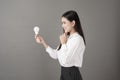Beautiful intelligent woman is holding light bulb in studio Royalty Free Stock Photo