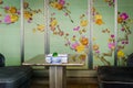 Beautiful interior of a chinese fine dining restaurant with chinoiserie wallpaper of flower pattern Royalty Free Stock Photo