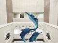 Beautiful interior decoration onside a hospital depicting 3 dolphins that represents harmony and balance Royalty Free Stock Photo