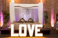 Beautiful interior design of a Wedding Dais with glowing LOVE text