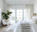 Beautiful interior of luxury bedroom with window sea view. Coastal cottage concept Royalty Free Stock Photo