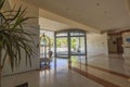 Beautiful interior view of empty entrance with carousel door of modern hotel. Greece. Royalty Free Stock Photo