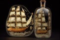 beautiful and intricate model of sailing ship, with detailed sails and rigging, inside clear glass bottle Royalty Free Stock Photo