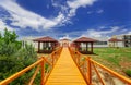 beautiful inviting view of resort grounds and gazebos on the side leading to outdoor spa room