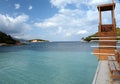 Beautiful Ionian Sea and clear turquoise water at Ksamil Islands with wooden pier after summer season in October Royalty Free Stock Photo