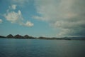 Beautiful island beach. View of tropical beach with blue sky In Labuan Bajo, Indonesia. Perfect blue sky with clouds and water of Royalty Free Stock Photo