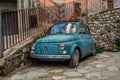 Beautiful Italian Charm in Rocca Imperiale: Vintage Blue Fiat 500 Abandoned on Stone Street