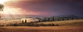 Beautiful Italian farm landscape with a beautiful field and a sky with clouds. Tuscany Italy Royalty Free Stock Photo