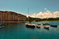 The beautiful Italian Portofino hotel, with colorfull villages and fishing boats in little bay Royalty Free Stock Photo