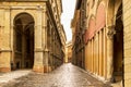 Beautiful Italian street, colourful buildings with porticos. Bologna, Italy Royalty Free Stock Photo