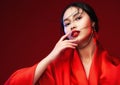 Beautiful Japanese Girl Face with Red Lips Makeup. Asian Beauty Woman in Red Silk Kimono Dress. Chinese Fashion Model. Fantasy