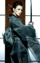 Beautiful japanese kimono woman with samurai sword Royalty Free Stock Photo