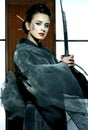 Beautiful japanese kimono woman with samurai sword