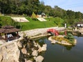 A beautiful Japanese-style landscape park in New Sofiyivka. Lake, wooden arbors, red bridge, Aerial view from drone on park. Uman Royalty Free Stock Photo