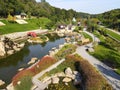 A beautiful Japanese-style landscape park in New Sofiyivka. Lake, wooden arbors, red bridge, Aerial view from drone on park. Uman Royalty Free Stock Photo