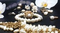 Beautiful jewelry white pearl set for woman and girl necklace earrings bracelet earring rings on black gold silver backgroun