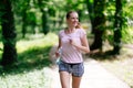 Beautiful jogging woman in nature Royalty Free Stock Photo