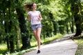 Beautiful jogging woman in nature Royalty Free Stock Photo