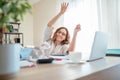 Beautiful joyful middle-aged woman in glasses extremely glad with new higher taxes and throwing bills UP. Small business troubles