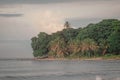 Beautiful jungle caribbean beach with nice surf close to Playa Cocles and Puerto Viejo in Costa rica. View towards the trees. hazy Royalty Free Stock Photo